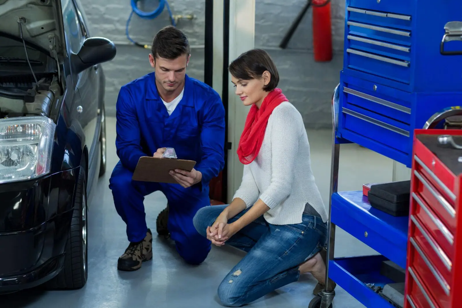 mechanic showing check list customer Auto Body Repair Shops Insurance amc insurance bcauto insurance commercial insurance liability min